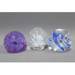 Caithness paperweights to include 'Whirlygig' and 'Rhythm n 'Blues' together with another (3) ,