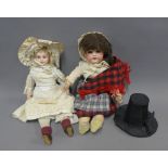 Two early 20th century dolls to include Heubach doll dressed in traditional Welsh costume and