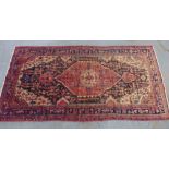 Persian rug, red field with central medallion with a serrated edge, with multiple borders, 320 x