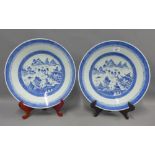 A pair of Chinese blue and white willow pattern chargers, 38cm diameter (2)