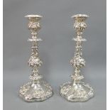 A pair of silver plated rococo style candlesticks, detachable scones, and weighted bases, 32cm (2)