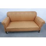 Edwardian drop end sofa with damask style upholstery, on mahogany legs with brass caps and