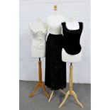 Two Cadolle Creations of Paris corsets, one in black velvet and satin, the other in cream satin,