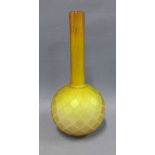 Burmese butterscotch coloured glass bottle neck vase with a latice pattern, likely a Thomas Webb