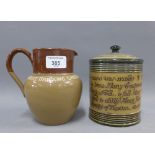 Doulton Lambeth tobacco jar and a Bournville Cocoa jug, tallest 15cm (2)