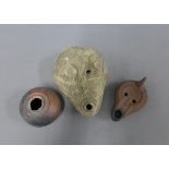 Two Roman style pottery lamps and a small stoneware vase, longest 16cm (3)