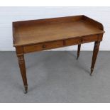 Mahogany library / writing desk with a three quarter gallery back and two frieze drawers, on