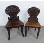 Georgian mahogany hall chair with shell back, solid seat and sabre legs together with another,