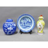 Chinese blue and white prunus jar and cover, Chinese yellow glazed vase and cover and a blue and