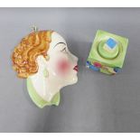 Clarice Cliff Fantasque Bizzare inkwell, (the cover repaired) and a C&Co pottery face wall mask,