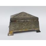 An Eastern silver casket box , cedar lined with a pyramid shaped lid and four outswept feet, 18 x