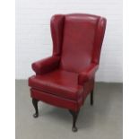 Wing armchair with red leather / vinyl upholstery and mahogany cabriole legs 70 x 112 x 50cm