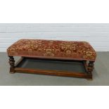 Footstool with plush floral upholstered rectangular top on turned legs and stretcher, 85 x 28 x 36cm