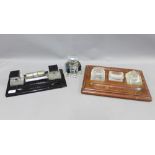 Early 20th century desk inkwells to include a black glass desk stand with chrome calendar, oak