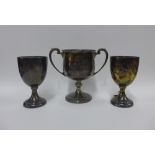 George V silver twin handled trophy cup, Birmingham 1937 and two Walker & Hall silver goblet