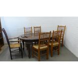 Mahogany dining table with oval top and carved cabriole legs together with five spindle back