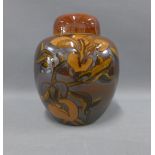 Early 20th century copper lustre glazed pottery jar and cover, 23cm