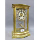 Brass mantle clock with four glass panels, silvered chapter ring with Roman numerals, 30 x 19cm