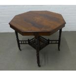 Victorian Aesthetic period rosewood table with octagonal top, ring turned legs and spindle gallery