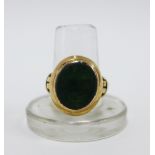 Vintage yellow metal ring inset oval bloodstone plaque, unmarked, UK ring approx 4.7g