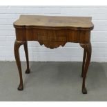 Queen Anne style walnut fold over table, the top with scalloped edge and compartments to the