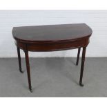 Mahogany fold over tea table on turned legs with brass castors, 98 x 72 x 99cm (open) and 49cm (