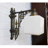 A pair of early 20th century wall lights with square opaque glass shades and Aesthetic styled