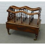Victorian rosewood Canterbury, the top with four divisions and spindles and pierced side supports,