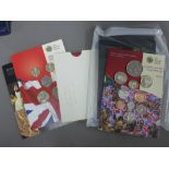 A carton containing a quantity of commemorative coins to include Pobjoy Mint cased sets, Coinage