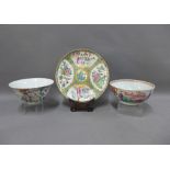 Collection of Chinese famille rose porcelain to include a plate with wooden stand, and two bowls, (