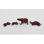 A collection of carved fruitwood animals to include a water buffalo, turtle and two fish, largest