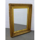 19th century giltwood picture frame converted into a wall mirror with later glass plate, 93 x 125cm