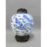 Chinese blue and white dragon pattern ginger jar with a pierced wooden cover and stand, size