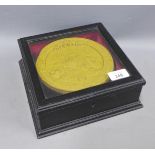 Queen Victoria Coronation plaque, (a/f) contained within a glazed and ebonised showcase, case is