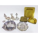 Mixed lot to include silver pepper pots, silver salt, white metal ashtrays and brass ashtrays,