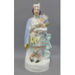 Staffordshire flatback pottery figure of a Piper, 37cm