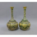 A pair of gilded green glass bottle neck vases, 17cm (2)