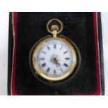 14 karat gold cased lady's fob watch, black roman numerals floral border and railroad outer