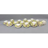 Collection of Dresden Helena Wolfson style porcelain cups and saucers, all with a yellow ground,