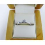 Diamond & platinum solitaire ring, claw set with a round brilliant cut diamond approx. 0.25ct,
