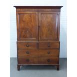 19th century mahogany linen press, stepped cornice over a pair of panelled cupboard doors, the