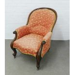 Mahogany framed armchair with pink upholstered back arms and seat, terminating on ceramic castors,