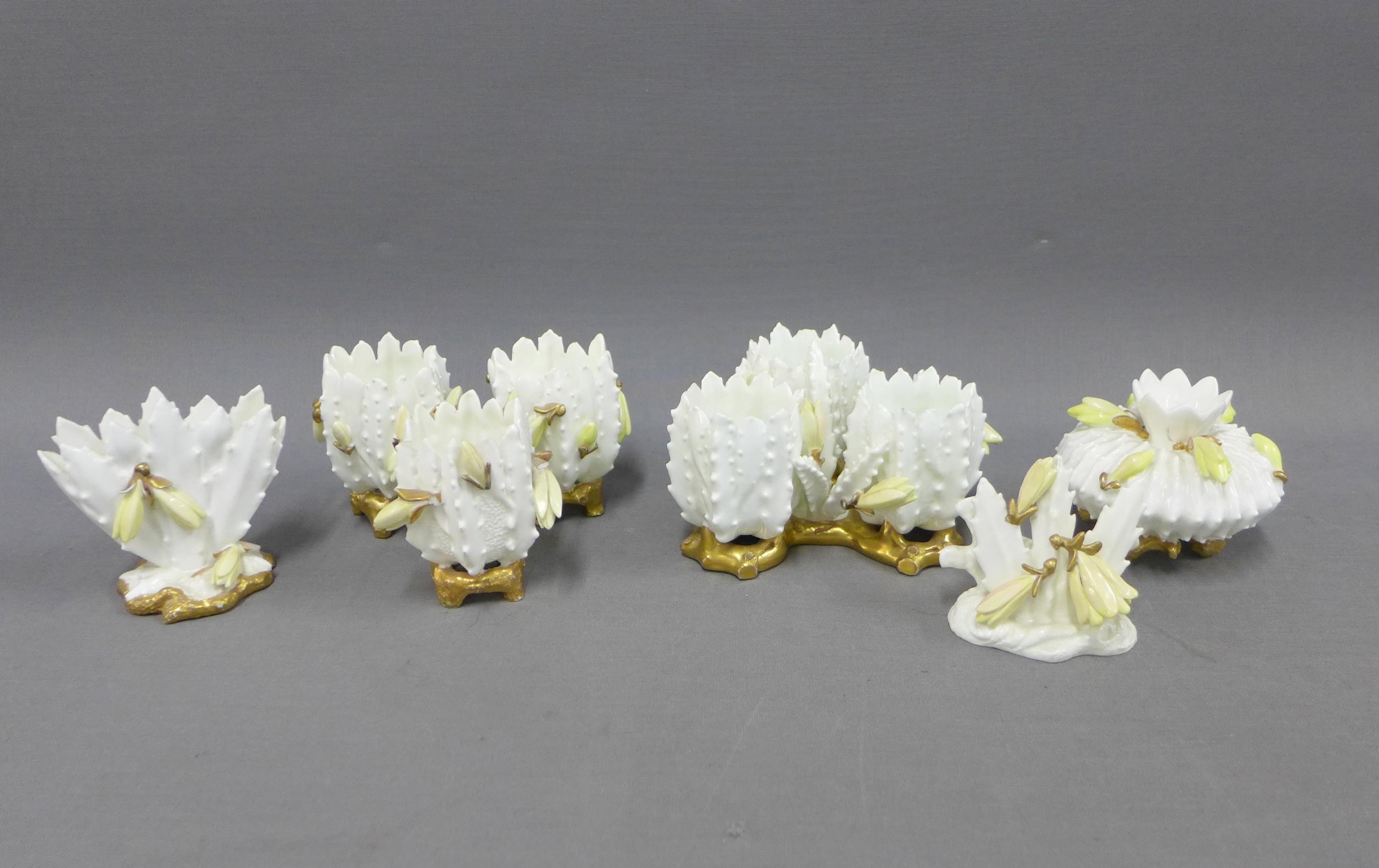 Moore Bros white glazed porcelain posy vases, tallest 7cm (7)