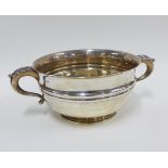 George V silver twin handled punch bowl, London 1919, with leaf clasped S scroll handles and