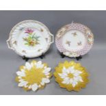 Two Meissen heavily gilded leaf moulded plates, Meissen plate with reticulated rim and painted