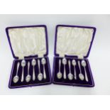 Two sets of six Scottish silver teapspoons, Glasgow 1914, each set contained within a purple