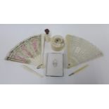 A collection of late 19th and early 20th century ivory items to include a trinket box, aide memoire,