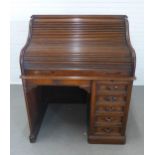 A roll top single pedestal desk, stamped Geo H. Derby & Co, Boston Mass. USA, (a/f) 105 x 129 x 84cm