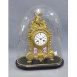 French gilt metal and porcelain mantle clock, the dial with black roman numerals, and signed