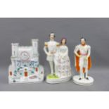 Staffordshire flatback pottery figures to include Queen Victoria and Prince Albert and a clock watch